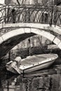 Boat under a Bridge in Venice. Black and White