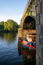 Boat underneath Twickenham bridge in Richmond-upon-thames, England