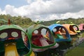 A boat with a unique shape is floating on a clear lake and has a very beautiful view. Jembangan, Kebumen - Indonesia. Good for p