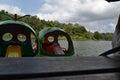 A boat with a unique shape is floating on a clear lake and has a very beautiful view. Jembangan, Kebumen - Indonesia. Good for p