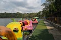 A boat with a unique shape is floating on a clear lake and has a very beautiful view. Jembangan, Kebumen - Indonesia. Good for p