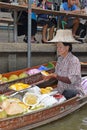 Boat vendor preparing mango sticky rice at floating market around Bangkok area Royalty Free Stock Photo