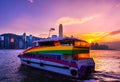 Boat in Victoria Harbour and Hong Kong skyline cityscape downtown skyscrapers over in the evening time with clouds. Hong Kong Royalty Free Stock Photo