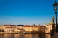 Boat on Vltava river at sunset in Prague seen from Charles Bridge Royalty Free Stock Photo