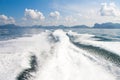 Boat wake prop wash on blue ocean sea
