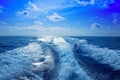 Boat wake prop wash foam in blue sky