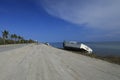 Boat washed up along shoreline