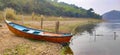 A boat on water bank. A boat near lake water.