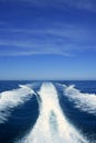 Boat white wake on the blue ocean sea Royalty Free Stock Photo