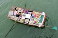 Boat woman selling goods in Halong Bay