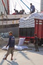 Boat and workers of the Sunda Kelapa harbour Jakarta, Indonesia