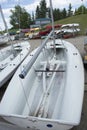 Boat yard with small sailing boats and kayaks Royalty Free Stock Photo