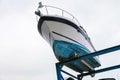 Boat yatch lifted to shelf for sale appreciation viewing with cloudy sky background