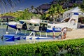 Boater photographing Sea Plane at Abaco Inn, Elbo Cay Abaco, Bahamas Royalty Free Stock Photo