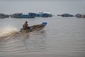 Boater in river at Tonle Sap, Cambodia Royalty Free Stock Photo