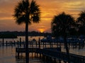 Boaters enjoy a lazy sunset as they cruise the Anclote River. Tarpon Springs, Florida Sunset Royalty Free Stock Photo