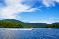 Boaters enjoy summer day on Lake Placid in New York State`s Adirondack Mountains Royalty Free Stock Photo