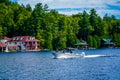 Boaters enjoy summer day on Lake Placid in New York State`s Adirondack Mountains Royalty Free Stock Photo