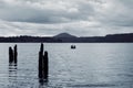 Boaters on Lake Quinault on an overcast, moody day