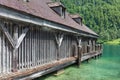 Boathouse German Konigssee with steep mountains and clear transparant water