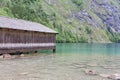 Boathouse German Konigssee with steep mountains and clear transparant water