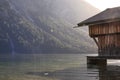 Boathouse at lake plansee in fall mood with streak