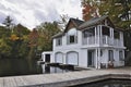 Boathouse nestled among the maple trees. Pier for boat and balcony for vista of the lake