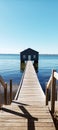 a boathouse sitting on top of a lake next to water