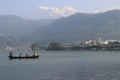 Boating in the lap of mountains.... boad with view of snow caped mountain. Pokhara nepal