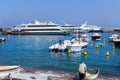 A boatman on a boat and a coastal fisherman in Marina Grande harbor, Italy. Royalty Free Stock Photo