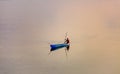Boatman on the rive boating with oars Royalty Free Stock Photo