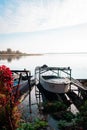 Boats above the water surface, suspended on a frame.