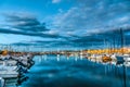 Boats in Alghero harbor at night