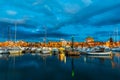 Boats in Alghero harbor at night