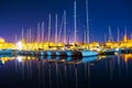 Boats in Alghero seaport on a clear night