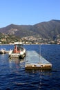 Boats along the coast in Lenno, Como lake, Italy. Beautiful touristic place