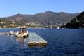 Boats along the coast in Lenno, Como lake, Italy. Beautiful touristic place