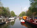 Boats in Amsterdams canal Royalty Free Stock Photo