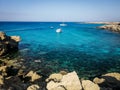 Boats anchored at bay, Blue Lagoon, Cape Greco, Cyprus. Royalty Free Stock Photo