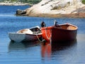 Boats anchored at bay over blue water Royalty Free Stock Photo