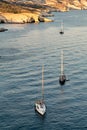 Boats anchored near Fleftiko, Milos Island, Cyclades, Greece Royalty Free Stock Photo