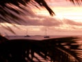 Boats anchored at the sea during a sunset after a storm in Tonga Royalty Free Stock Photo