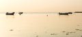 Boats anchoring in a calm bay at the Baltic Sea in beautiful bronze morning light