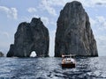 Boats Approaching the Tunnel of Love, Faraglioni Rocks, Capri Royalty Free Stock Photo
