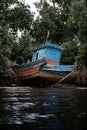 Blue Boat on the banks of the Zaire River on the border between Angola and the Democratic Republic of Congo