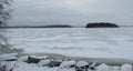 Boats on the beach of icy lake Royalty Free Stock Photo