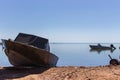 Boats on the beach. Nautical vessel. Fishing boat in dock. Marine transport. Sea bay landscape. Seascape background. Royalty Free Stock Photo