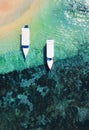 Boats on the beach from top view. Water background from drone. Summer seascape from air. Bali, Indonesia. Royalty Free Stock Photo