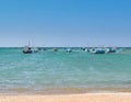 Boats beach waves blue sky Royalty Free Stock Photo