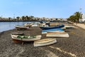 Boats beached in the outer lagoon of Charco de San Gines at low tide in Arrecife, Lanzarote